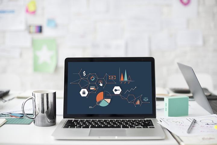 Laptop showing business charts and reports